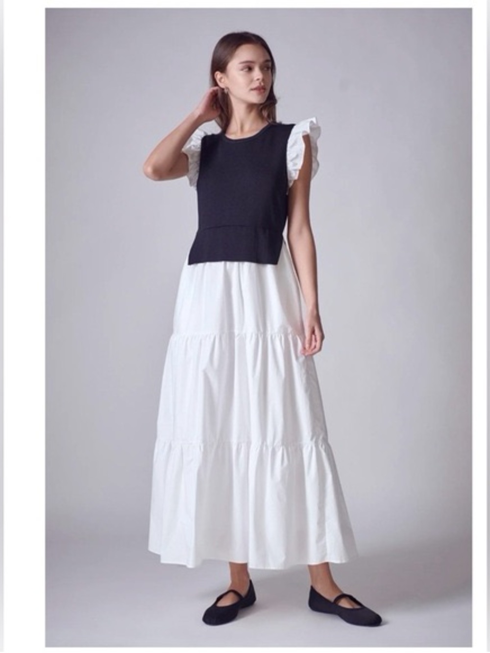 English Factory Black Crop Sweater Vest over White Ruffle Sleeve Maxi Dress